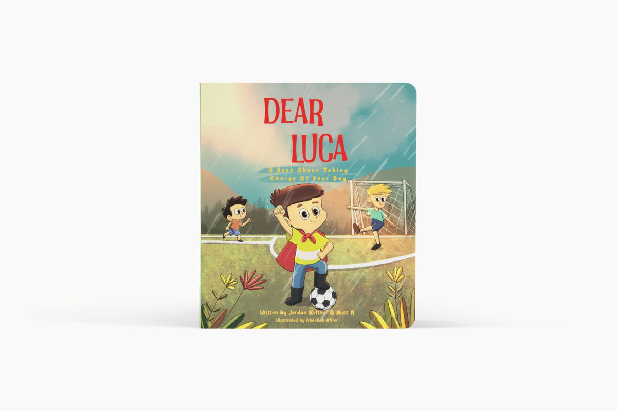 Dear Luca: A Book About Taking Charge of Your Day board book cover, Luca in a red cape playing soccer with friends